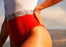 Détail maillot de natation 1 pièce orange et blanc la roda